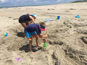 Kids digging in Sand